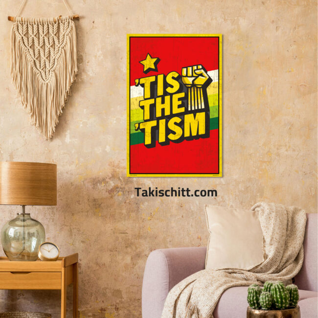 Tis The Tism poster being displayed on a beige wall in a front room above a couch, next to a table and lamp and marcrame wall hanging